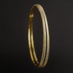 Set of 2 Gold Bangles  in Yellow Gold and Rhodium Polish